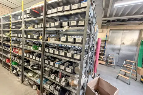 Contents of 3 shelves: machine spare parts