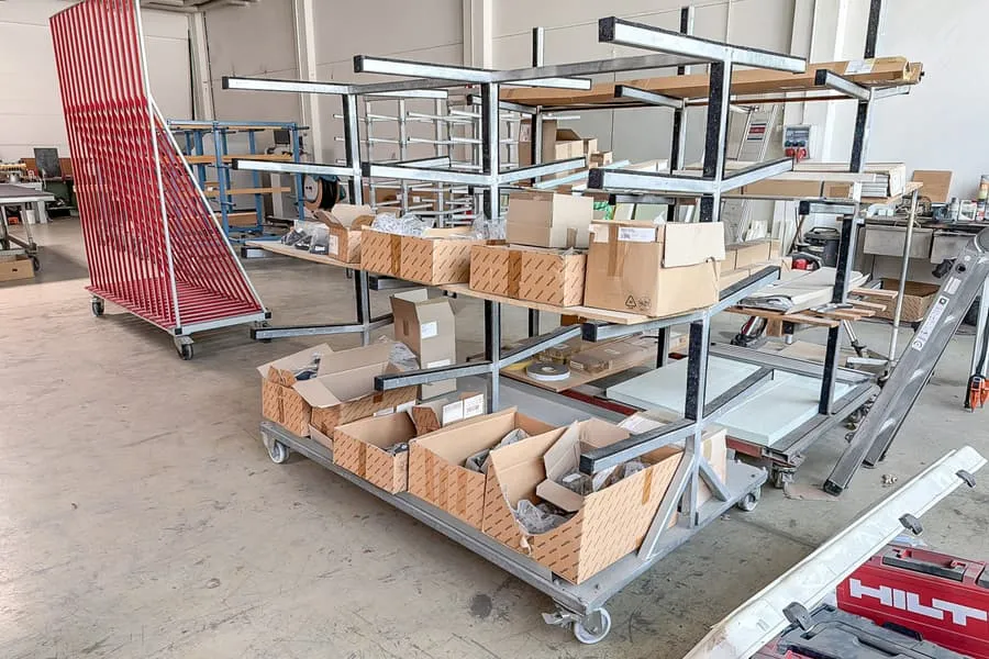 Multi-tier transport trolley with contents: various Schüco accessories