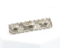 Brooch, Art Deco, 14kt white gold, three brilliants total approx. 0.70 ct, small diamonds, approx. 10.3 g
