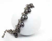 Collier, or blanc 18 ct, env. 290 petits brillants et diamants, 26 perles de Tahiti ovales, env. 12 mm, env. 46 g, env. 42 cm, 1 perle détachée