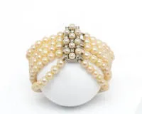 Bracelet de perles, 5 rangs, perles ø env. 5.5 mm, fermoir or blanc 14 ct, 11 petits diamants, 18.5 cm