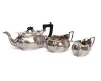 Tea service, silver 925, Birmingham, 1927, maker's mark "W.A" (William Adams), teapot, sugar bowl and cream jug, the teapot with ebonised wood handle, total weight 1,006 g