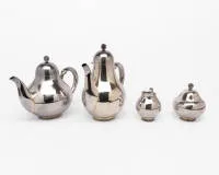 Silver service consisting of teapot, coffee pot, cream jug and sugar bowl, 2nd half 20th century, silver 925, each pear-shaped with smooth wall on round base with double row of pearls, knobs in berry form, together 1,536 g