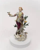Porcelain figurine, "Shepherd with Bird", Meissen, crossed swords mark, probably 1980s, 1st choice, model number 61079, polychrome and gilded, model design by Johann Joachim Kändler (1706-1775), 26.5 cm high, ear of corn glued, leaves missing