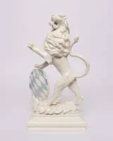 Bavarian lion, Nymphenburg, with blue and white lozenge shield, green base mark, 20th c., H. 35 cm