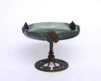 Footed bowl, Art Nouveau style, 20th c., iridescent green glass with wave structure, bronze stem with relief leaf ornament, 15 cm high, ø 20.5 cm