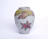 Vase, probably France, 19th c., conical, decorated in Chinese export style with flowers, scrolls and mosaic border, polychrome, gold lines, pseudo-mark in iron red on the base, 19.5 cm high, glaze irregularities