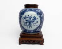Covered jar (so-called ginger jar), China, probably Kangxi period (1662-1722), porcelain with underglaze blue, baluster-shaped body, decorated with four lobed reserves with scholar's attributes (bogutu) on a dense ground of plum blossoms on...