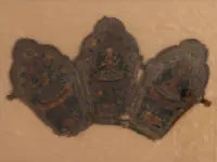 Painted leather ritual crown / Tibet, three-leaf crown worn on ceremonial occasions. The slightly conical panels each bear a larger depiction of a deity in the centre. Crown with signs of ageing...