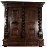 Monumental Baroque hall cupboard, South German, probably Swabia, around 1700, walnut veneer on softwood, two-door body divisible in the middle under strongly projecting cornice, front with three Solomonic columns with Corinthianising capitals on...