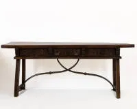 Baroque Spanish refectory table of solid walnut, Castile, circa 1680 - 1700, walnut, solid one-piece top over carved apron with three drawers and ornamental carving, similarly carved four-legged base with...