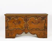 Chest, Alpine, dated 1779, front with relief carving of rocailles, partly polychrome, serpentine apron dated "1779", interior compartment on right, lock replaced, approx. 73 x 126 x 49.5 cm