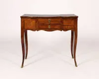 Rococo poudreuse / dressing table, Louis XV, France, circa 1760, rosewood veneered, body with three drawers and pull-out tableau on high curved legs in sabots, the top opens in three parts, the central element with interior mirror...