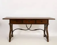 Desk, Spain, 18th/19th c., walnut, rectangular top over three-drawer apron, curved side panels with wrought-iron struts, approx. 78 x 170 x 83 cm