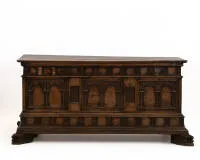 Spanish Baroque chest, 1st half 18th c., solid walnut, rectangular body on stylized claw feet, front carved with portal motifs, flat lid with corresponding carving inside, approx. 68 x 148 x 60 cm