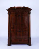 Secretary, Empire, probably Berlin, 1st half 19th c., pyramid mahogany, tall body with fall front over three drawers and flanking full columns under Ionic capitals, stepped pediment with drawer, fluted top drawer, 168.5 x 107.5 x 59.5 cm