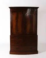 Linen press cupboard, England, 1st third 20th c., design after Sheraton, body with bowed front, lower section with four drawers in three tiers, upper section with two doors, interior with pull-out shelves, 206 x 130 x 62 cm