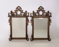 2 mirrors, probably 19th or 20th century, Venetian style, openwork carved frames, each 123 x 74 cm, partial loss of colour