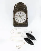 Comtoise clock, France, circa 1800, signed "Achambaud a Nion (?)", pediment with two doves and head in a halo, pendulum and two weights, date display and repetition