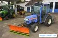 Iseki TH 4330 AHL čtyřkolový kompaktní traktor zimní údržba s hydraulickým sněhovým pluhem a samonakládacím sypačem soli z roku 2006