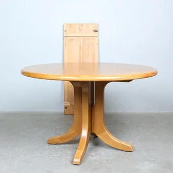 RAINER DAUMILLER. Round dining table in beech with extension leaf, 1970s.