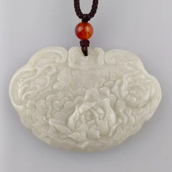 PLAQUE DE JADE EN FORME DE RUYI - CHINE 20E SIÈCLE.