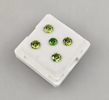 Five loose natural demantoids totaling 2.29 ct.