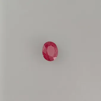 Loose oval-cut ruby of 3.83 ct, IGI certificate.