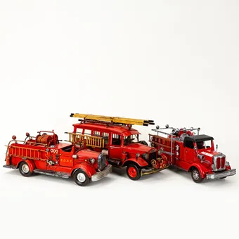 Tin fire engines, painted red and black, decorative models (3).