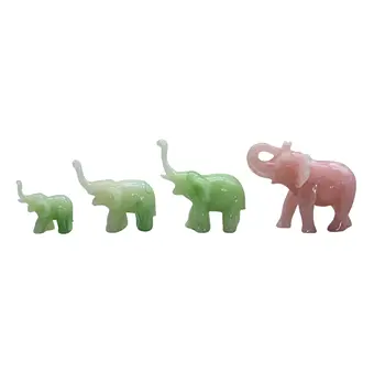 SET AUS VIER ELEFANTENFIGUREN AUS STEIN UND ROSENQUARZ.