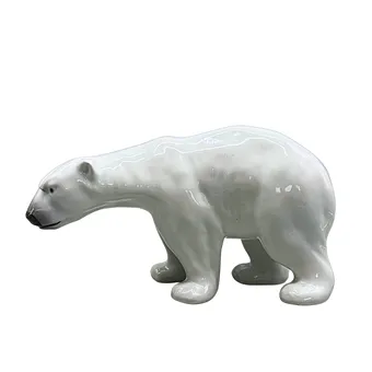 ФИГУРКА БЕЛОГО МЕДВЕДЯ ИЗ ФАРФОРА.