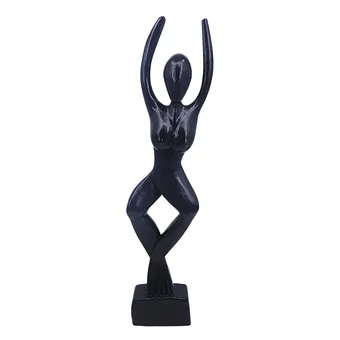 HOLZFIGUR EINER TANZENDEN FRAU.
