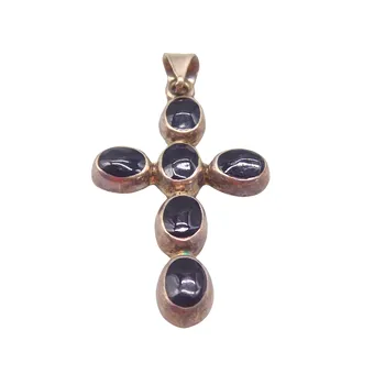 CROSS PENDANT IN SILVER SET WITH 6 ONYX STONES.