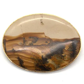 Designer broche met landschapsagaat gezet in verguld zilver, 20e eeuw.