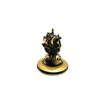 Bronzen presse-papier, schip op globe.