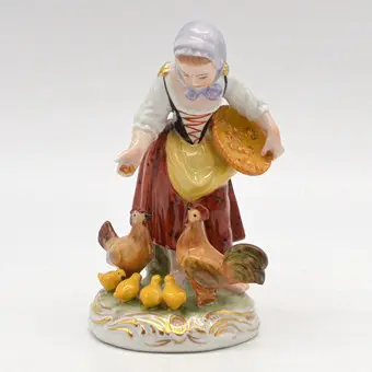 Ernst Bohne & Söhne. "Peasant woman and chickens", Thuringian porcelain figurine, polychrome, Germany, circa 1950.