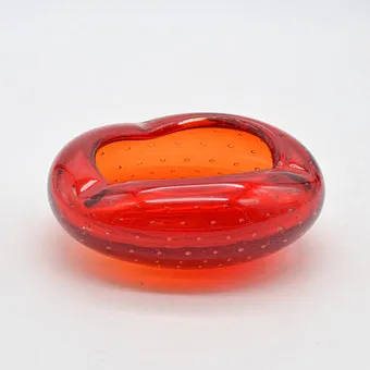 Scandinavian designer bowl, studio glass, red, controlled air inclusions, circa 1950.