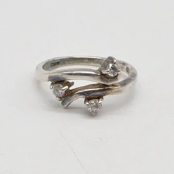 Handmade sterling silver ring by "ANY", organic form with zirconia, late 20th century.