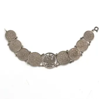 BRACELET ANTIQUE RUSSE EN ARGENT AVEC PIÈCES, AIGLE BICÉPHALE AU CENTRE, FAIT MAIN, RUSSIE VERS 1914.