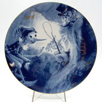 Meissen. Assiette murale, « Les Aventures de Pinocchio », 20e siècle, 1er choix, D. 25,5 cm.