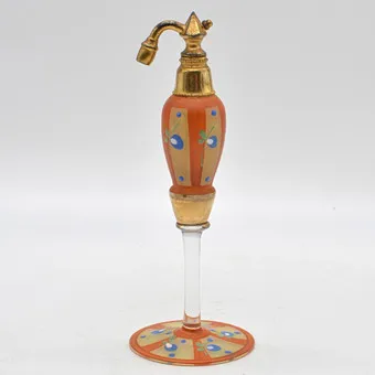 ANTIKER PARFÜMZERSTRÄUBER AUS FRANKREICH, ART DECO, GLAS UND MESSING, EMAILLE- UND GOLDDEKOR, UM 1920.