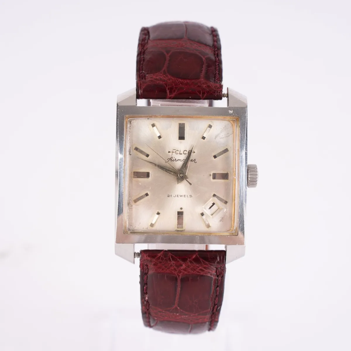 FELCA - Airmaster Herrenarmbanduhr, Mitte 20. Jhd., leicht gewölbtes, rechteckiges Stahlgehäuse, Ziffernblatt mit Indize…