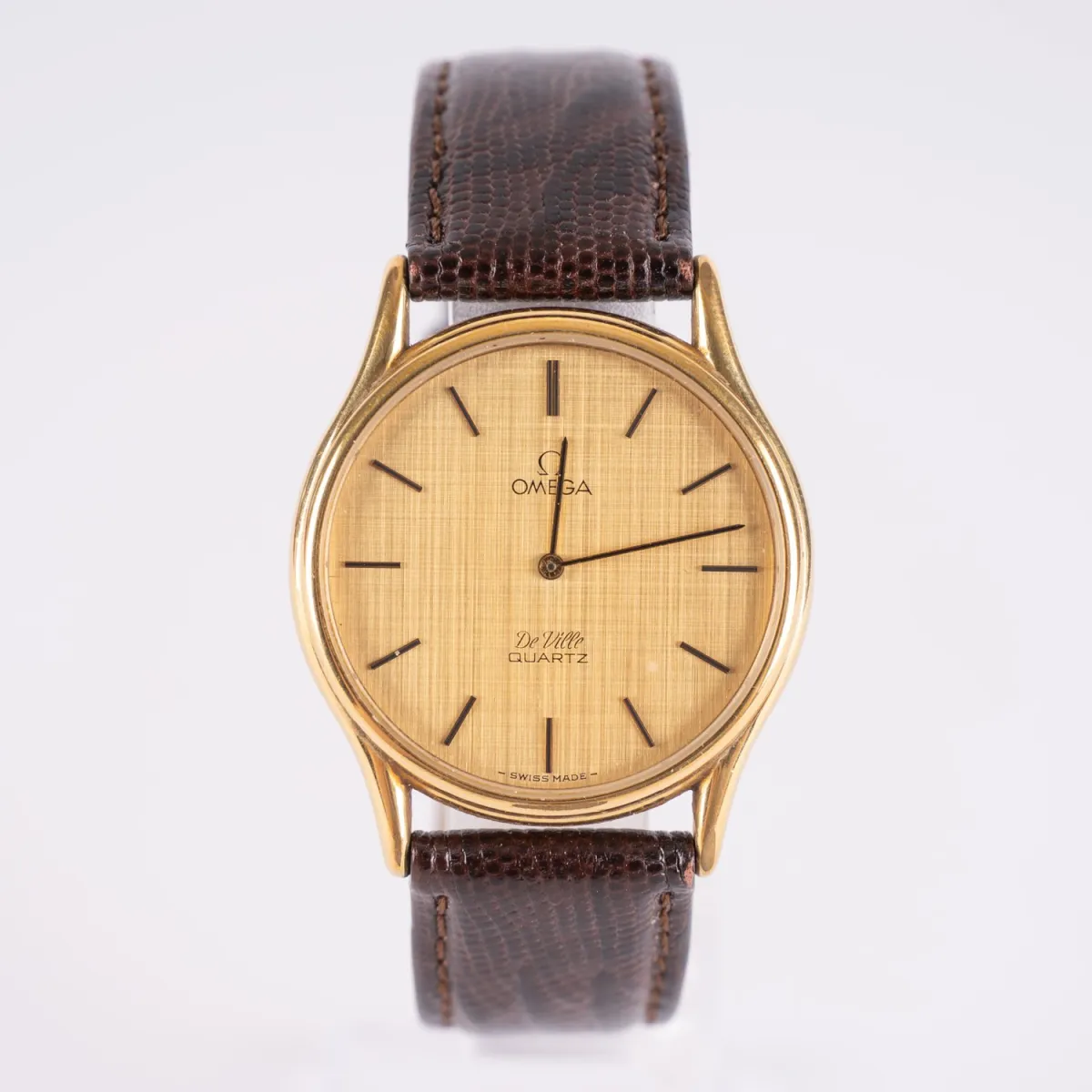OMEGA DE VILLE, Zegarek męski kwarcowy, stal pozłacana, luneta odłamana, niesprawdzony, średnica koperty ok. 33mm, …