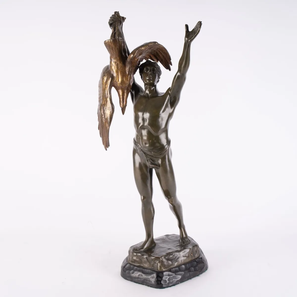 The Hunter's Triumph - polychrome patinated bronze figure of a standing youth wearing only a loincloth…