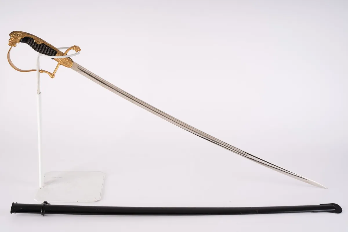 Lion head saber for artillery officers with crossed cannons on the guard.