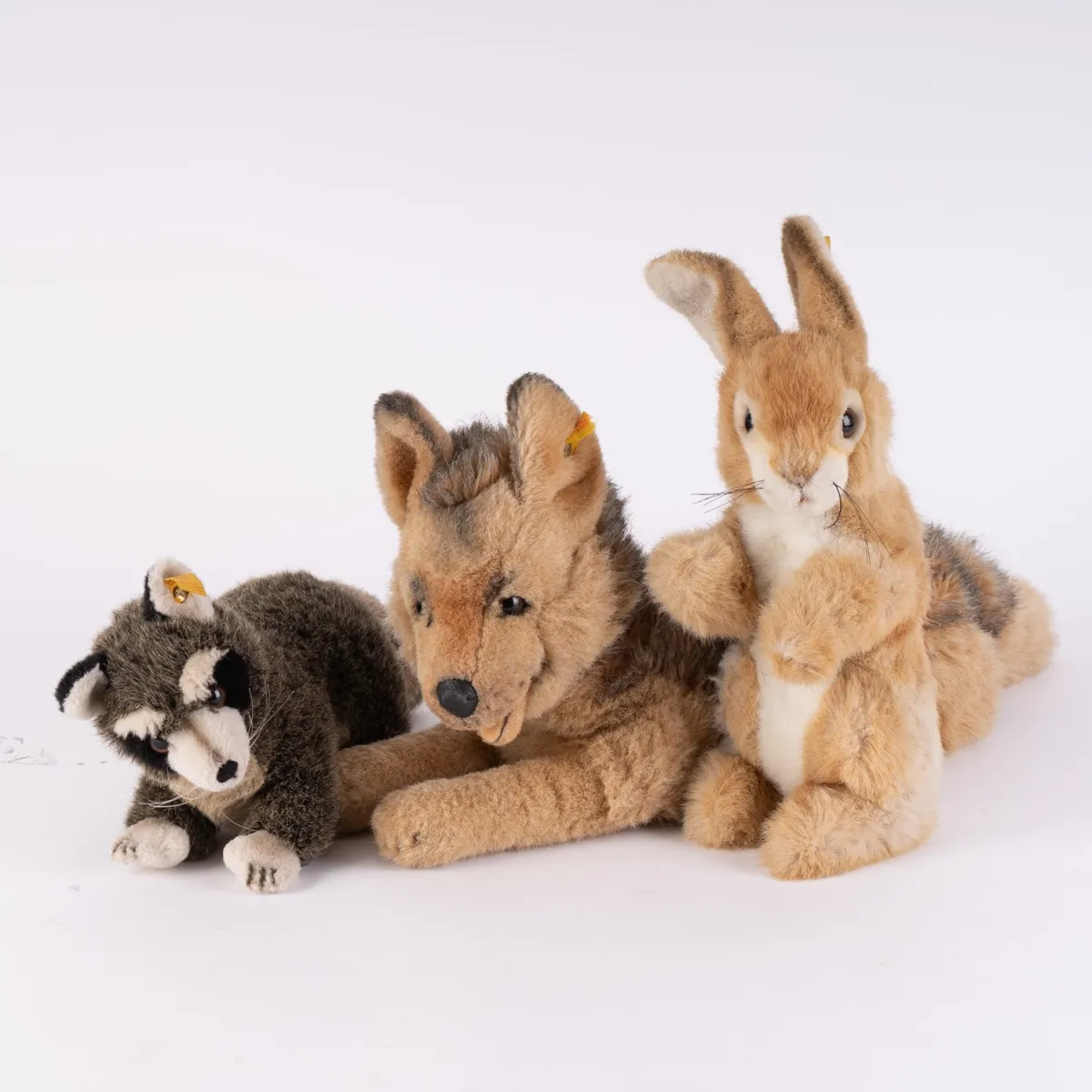 3 different STEIFF - ANIMALS, ear each with button and flag, from collection, consisting of: hare Putsi (height approx. 3…