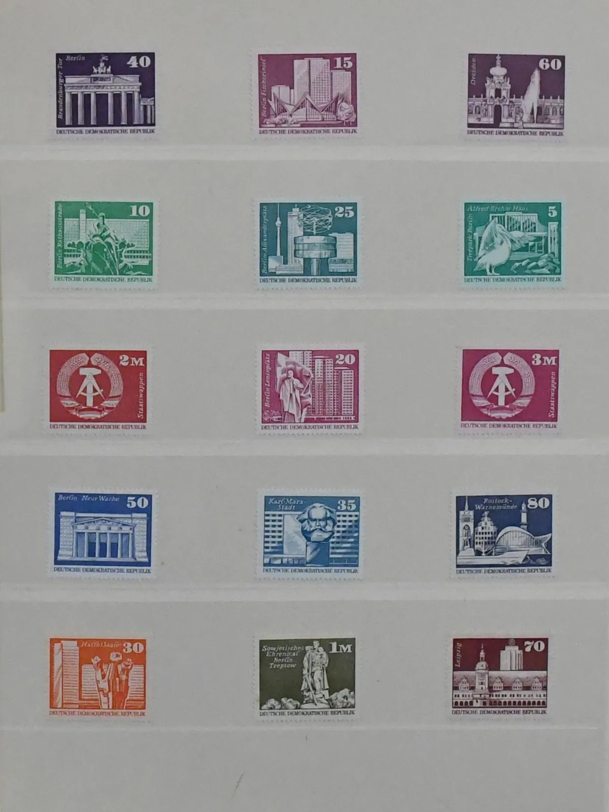 GDR, specialized collection of the small and large buildings issues, mint, used and with covers. Including blocks of four, coil stamps, some in strips of five,…