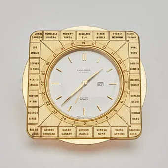 LOOPING. World time clock / alarm clock, 8-day power reserve, brass, 15 jewels, mid-20th century, Switzerland.