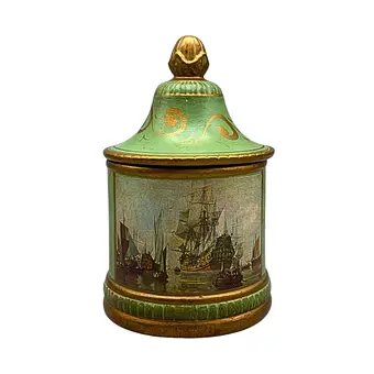 Boîte couvercle en céramique avec motifs de navires en vert.
