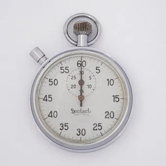 HANHART STOPWATCH, CROWN STOPPER STOPWATCH, 7 JEWELS, MECHANICAL, ANTIMAGNETIC NICKEL CASE, WHITE DIAL, CENTER SECOND HAND WITH 60-SECOND COUNTER, SMALL MINUTE HAND WITH 30-MINUTE COUNTER.